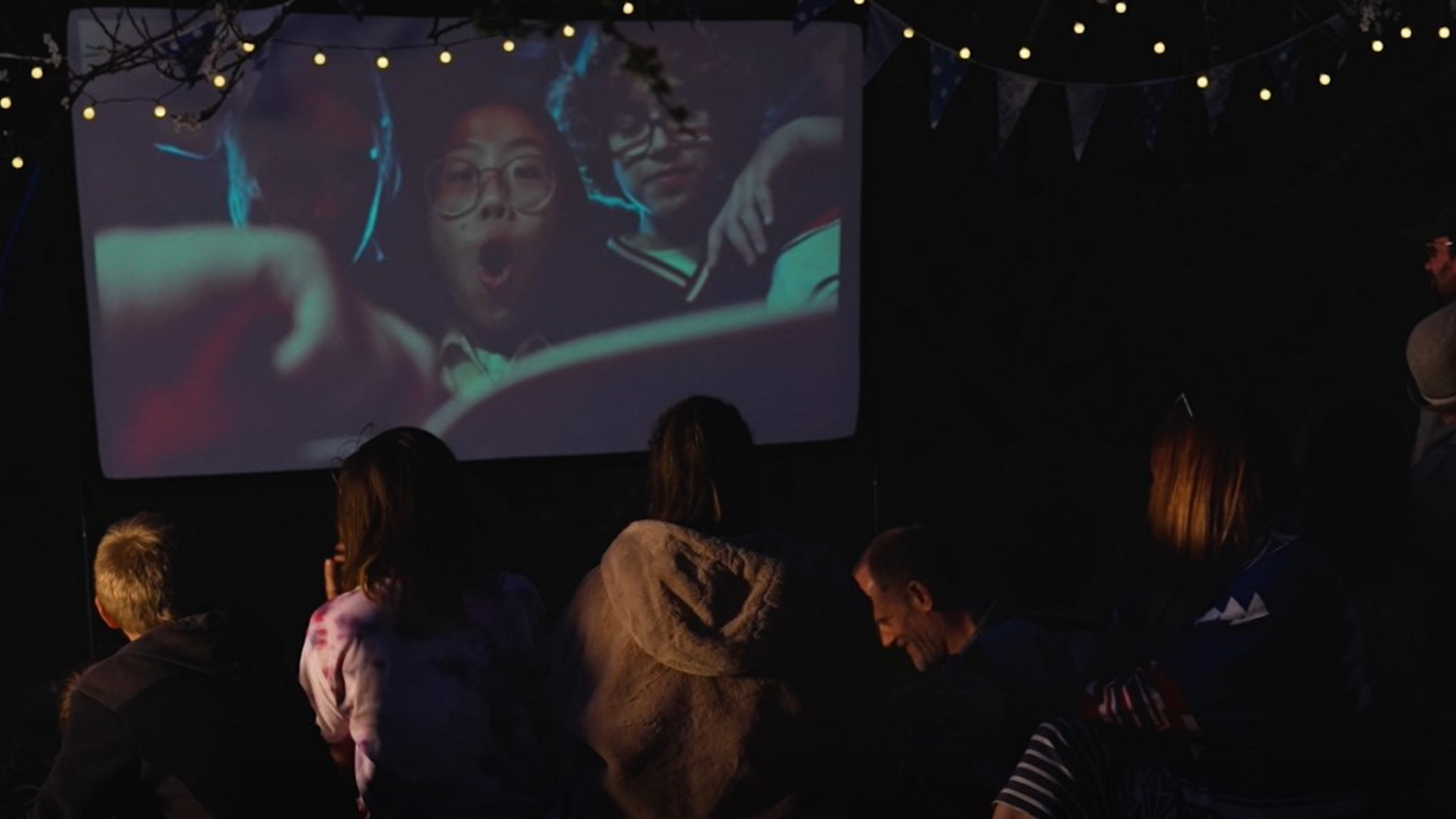 Image of children watching a film on a pop up cinema screen